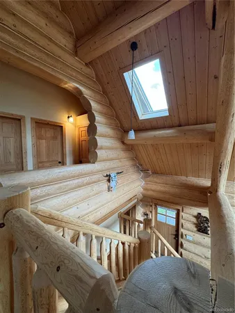 a living room with furniture and fireplace