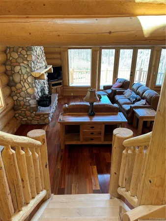 a view of entryway with wooden floor and windows