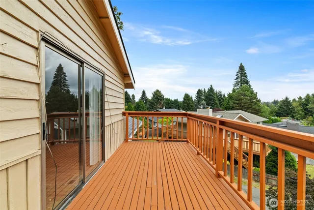 a view of balcony with couch and wooden floor
