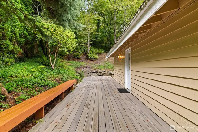 a view of balcony with wooden floor and fence