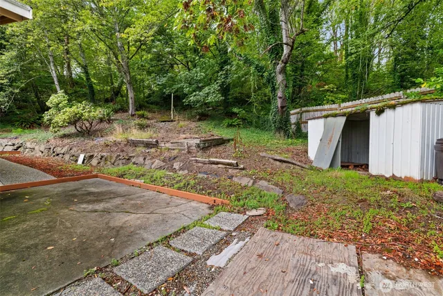 a backyard of a house with lots of green space