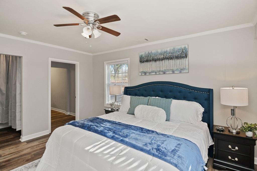 1917 Spring Avenue Atlanta, GA 30344 - Photo 11 of 22 a bedroom with a bed and a lamp on the dresser
