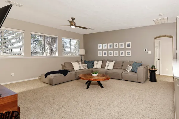 a living room with furniture and a rug