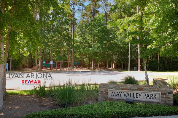 a view of a park with swings and slides
