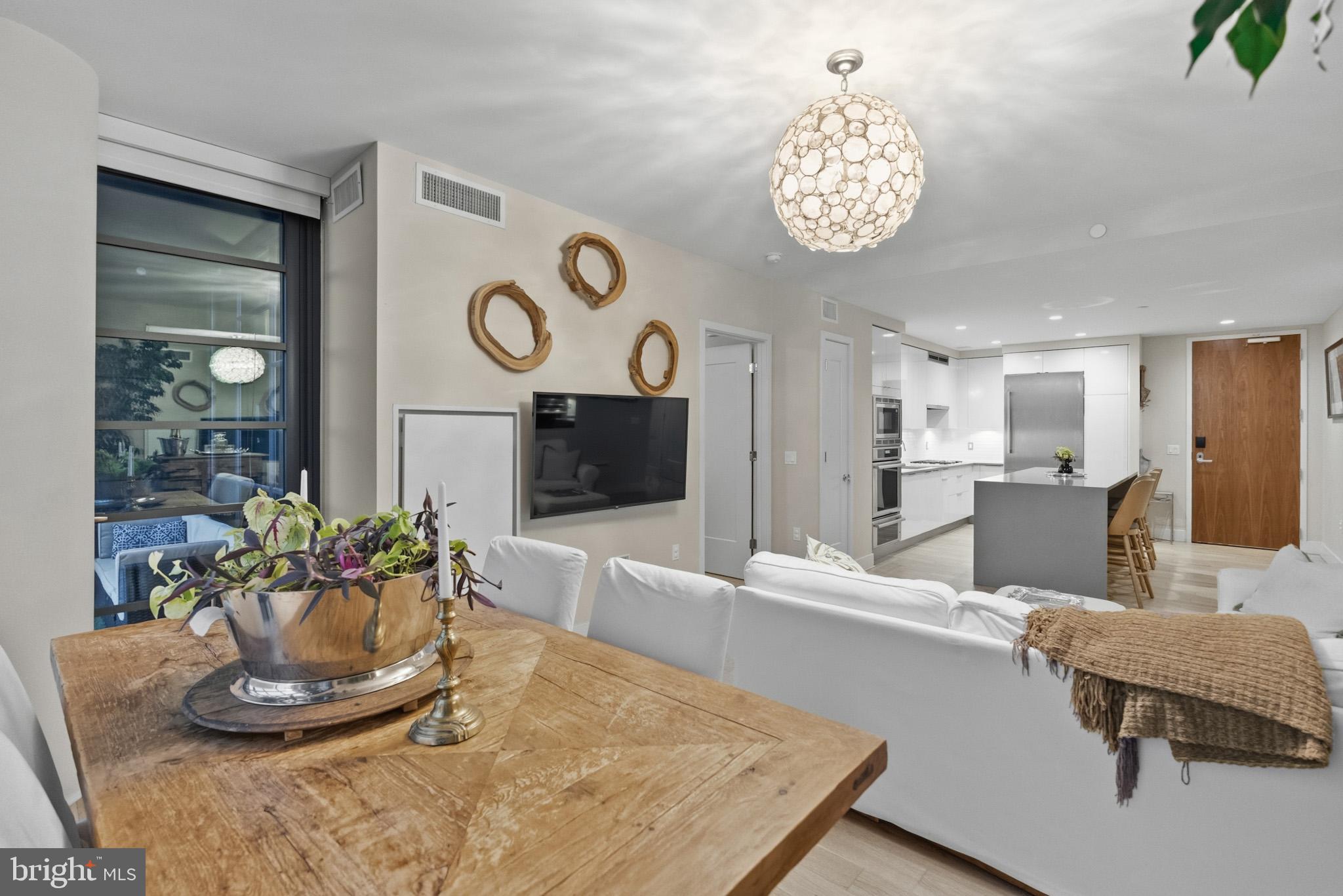 45 Sutton Square Southwest, Unit 403 Washington, DC 20024 - Photo 25 of 80 a living room with furniture and a fireplace