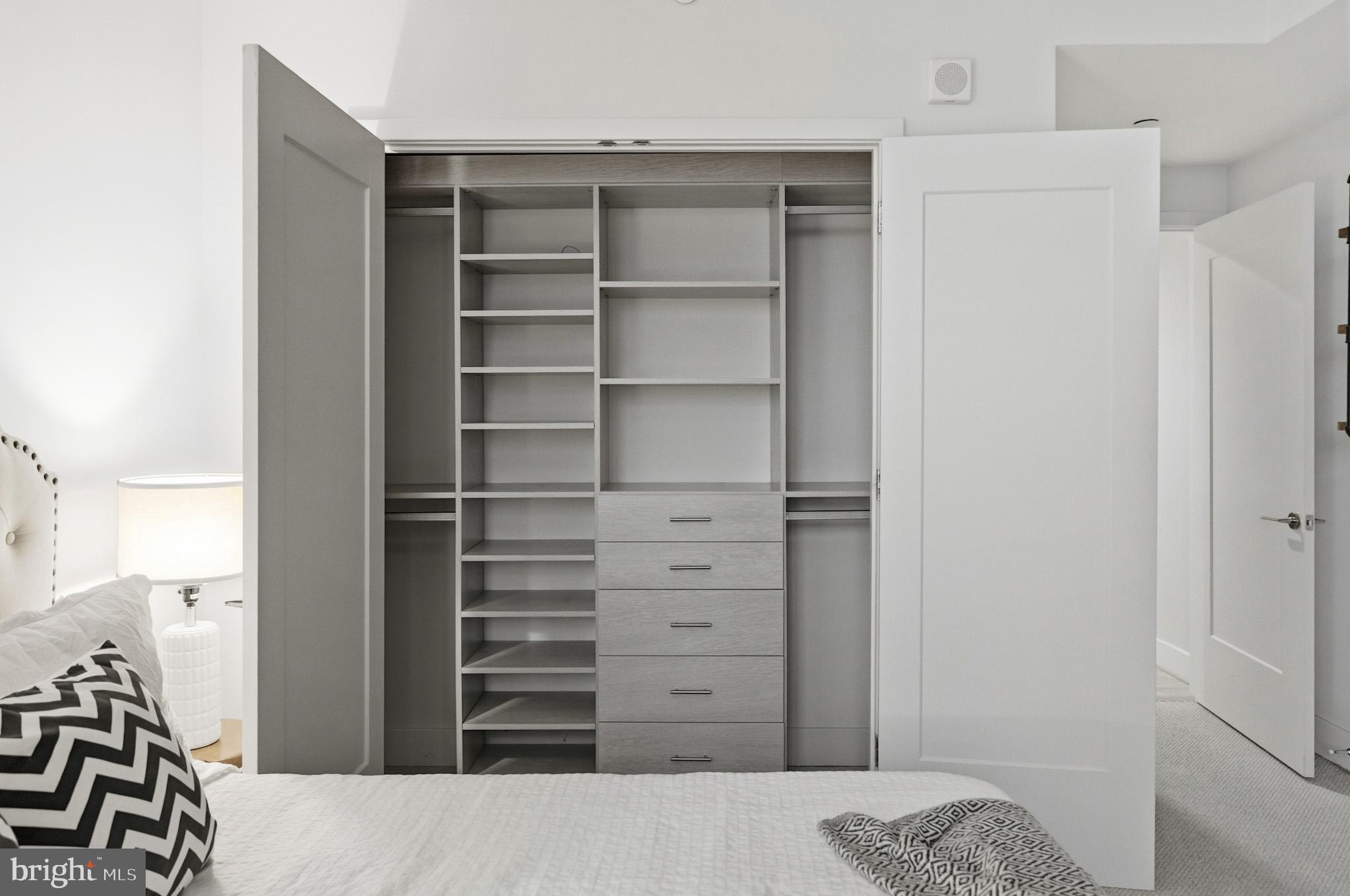 45 Sutton Square Southwest, Unit 403 Washington, DC 20024 - Photo 34 of 80 a view of walk in closet with clothes