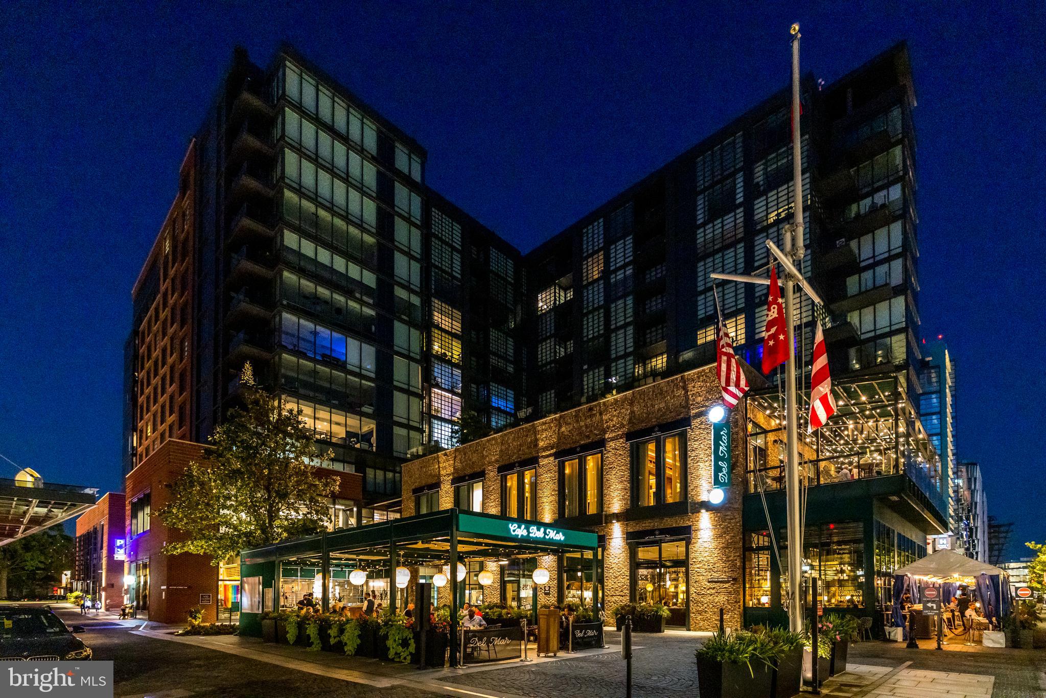45 Sutton Square Southwest, Unit 403 Washington, DC 20024 - Photo 63 of 80 a city street lined with tall buildings and cars parked