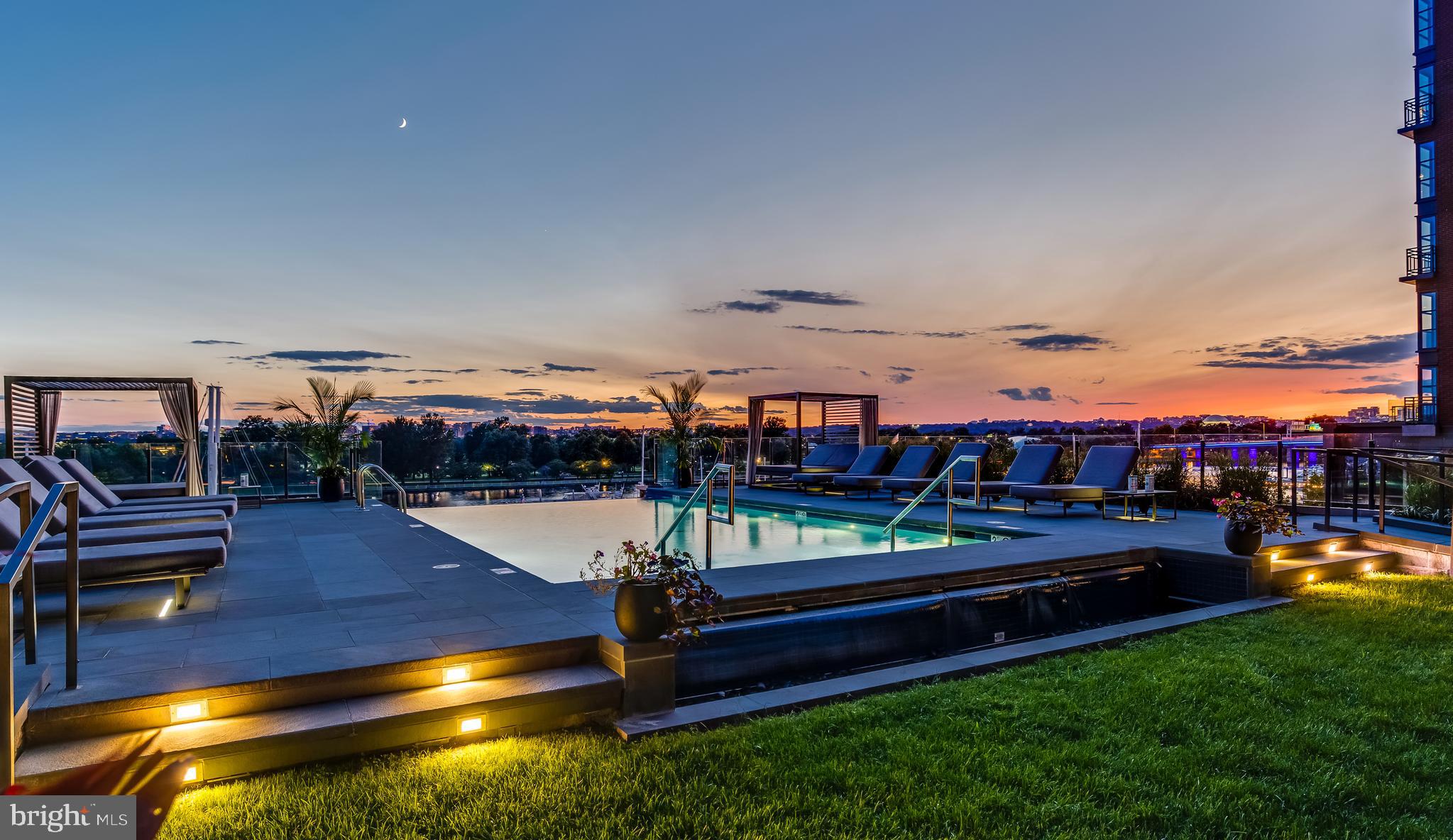 45 Sutton Square Southwest, Unit 403 Washington, DC 20024 - Photo 77 of 80 a view of a swimming pool with seating area and hardwood