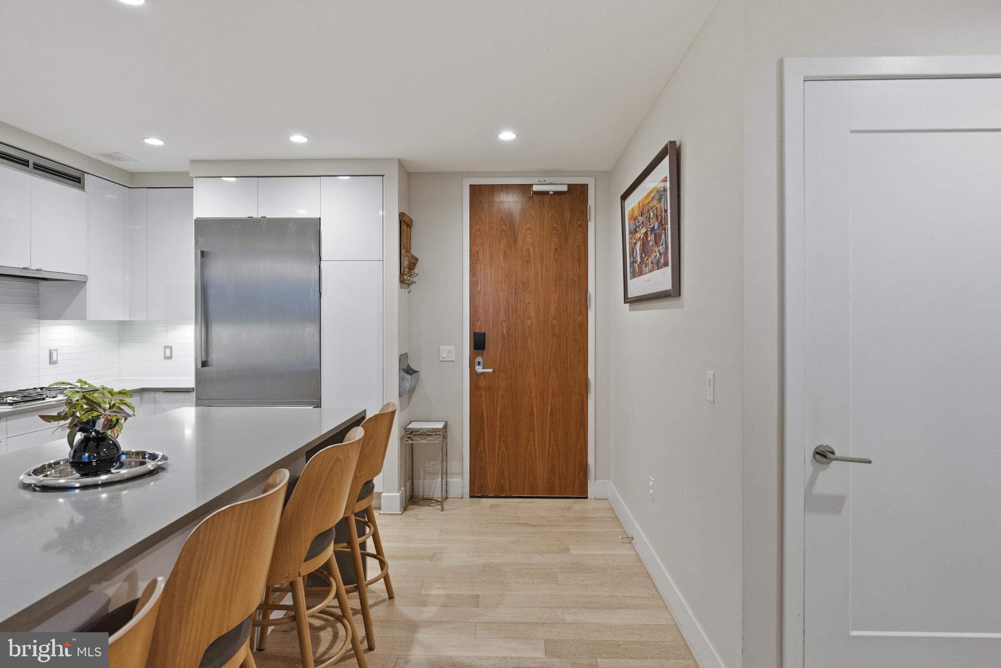 45 Sutton Square Southwest, Unit 403 Washington, DC 20024 - Photo 10 of 80 a kitchen with stainless steel appliances granite countertop a refrigerator and a stove top oven