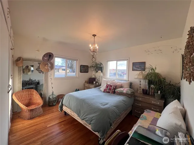 a bedroom with a bed and window