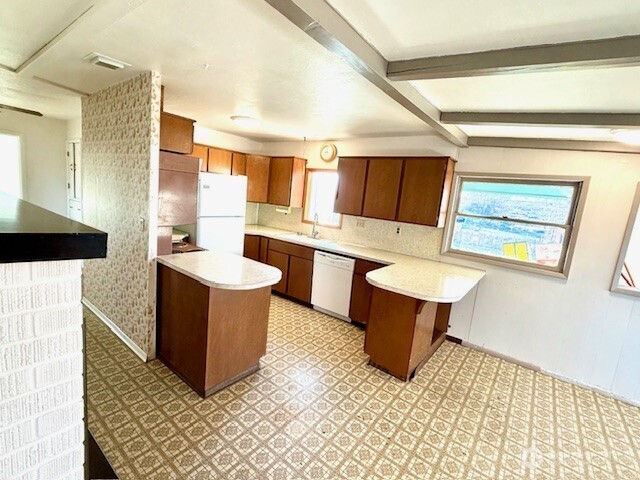 1006 East Dobson Road Odessa, WA 99159 - Photo 14 of 38 a kitchen with a sink and a stove top oven