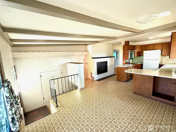 a view of kitchen with furniture and wooden floor