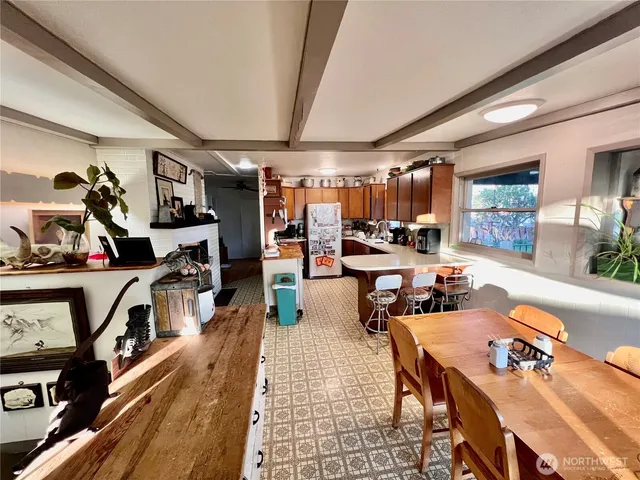a living room with lots of furniture and clutter