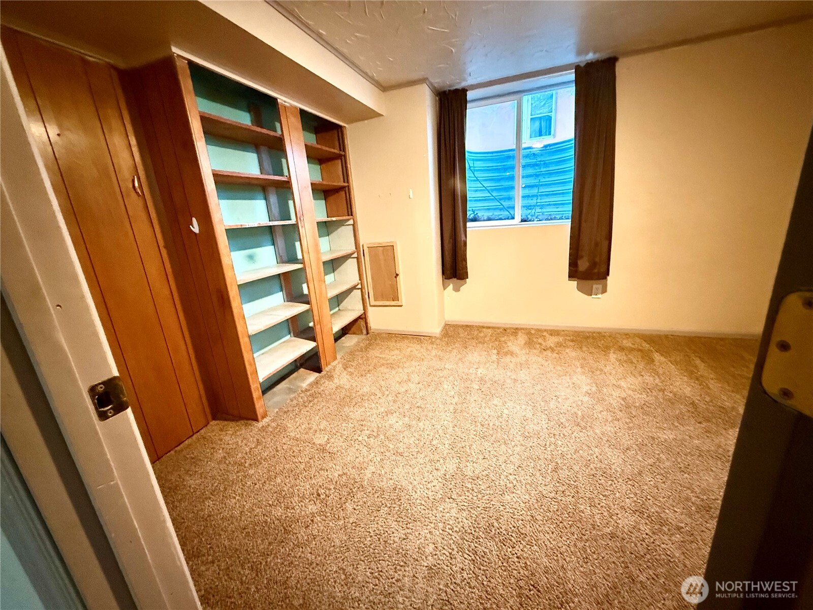 1006 East Dobson Road Odessa, WA 99159 - Photo 27 of 38 view of an empty room with wooden floor and door