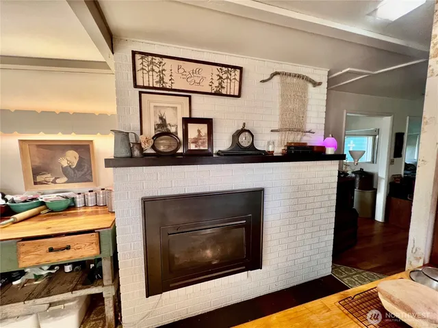 a kitchen with stainless steel appliances kitchen island granite countertop a stove and cabinets