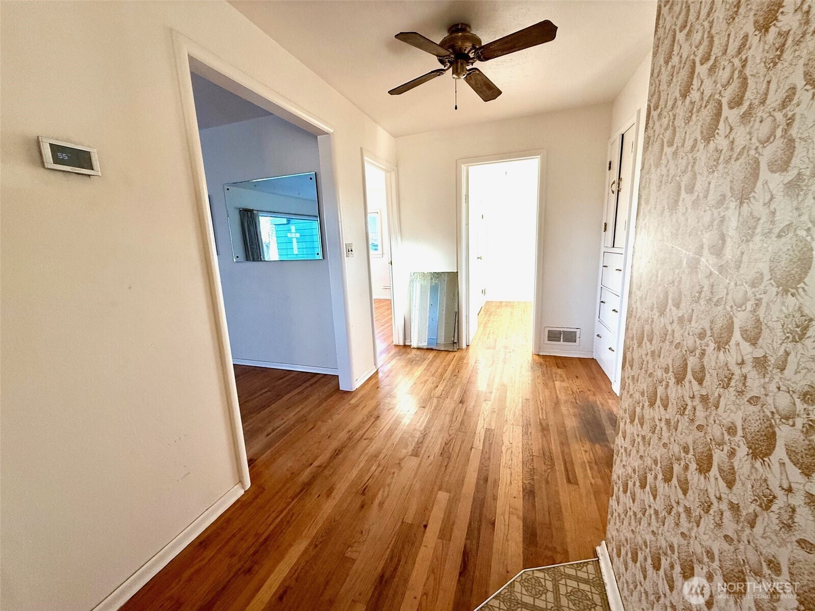1006 East Dobson Road Odessa, WA 99159 - Photo 9 of 38 a view of empty room with wooden floor and fan