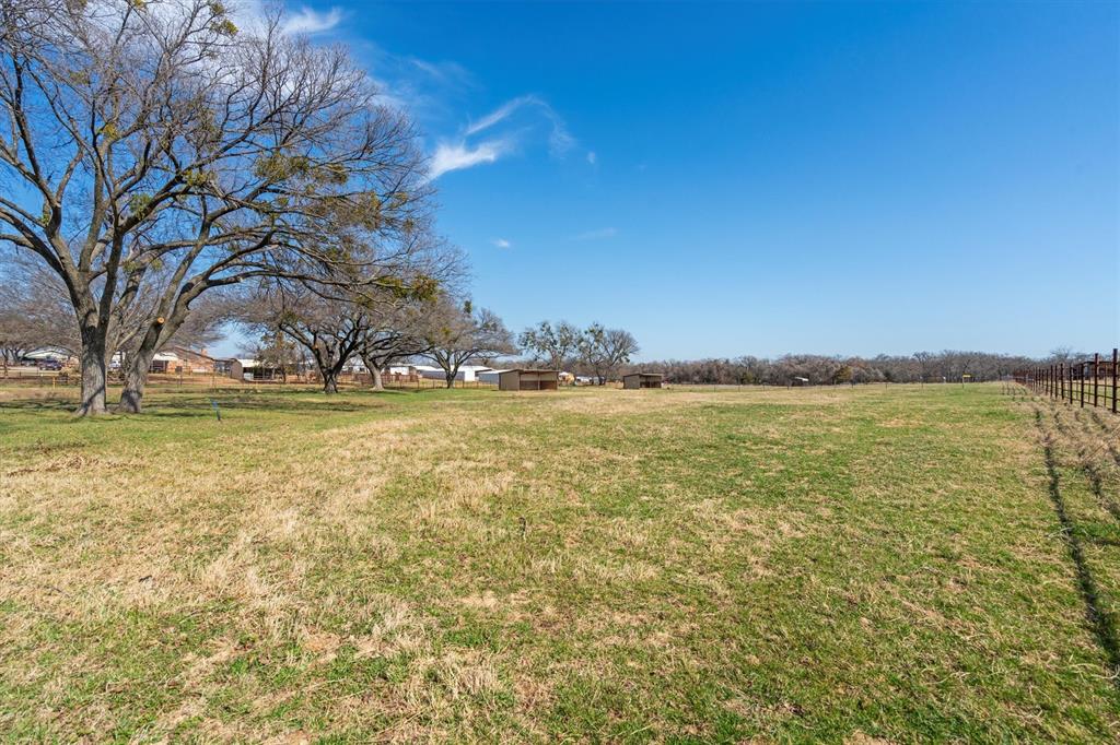 700 Gilliland Road Springtown, TX 76082 - Photo 5 of 12 a view of a large body of water with a building in the background