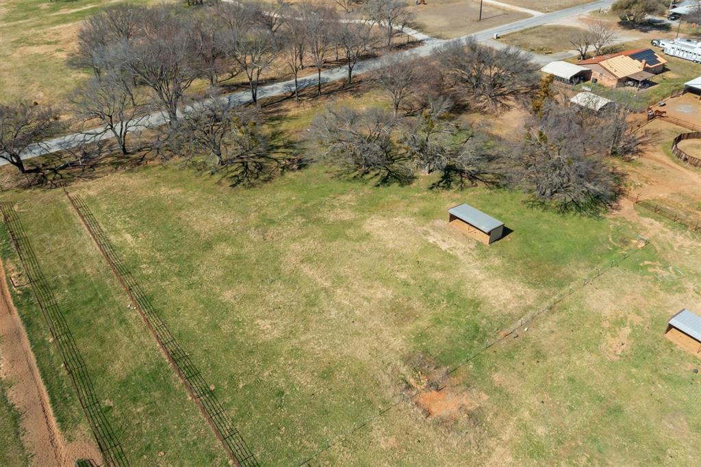 700 Gilliland Road Springtown, TX 76082 - Photo 8 of 12 a view of residential houses with swimming pool