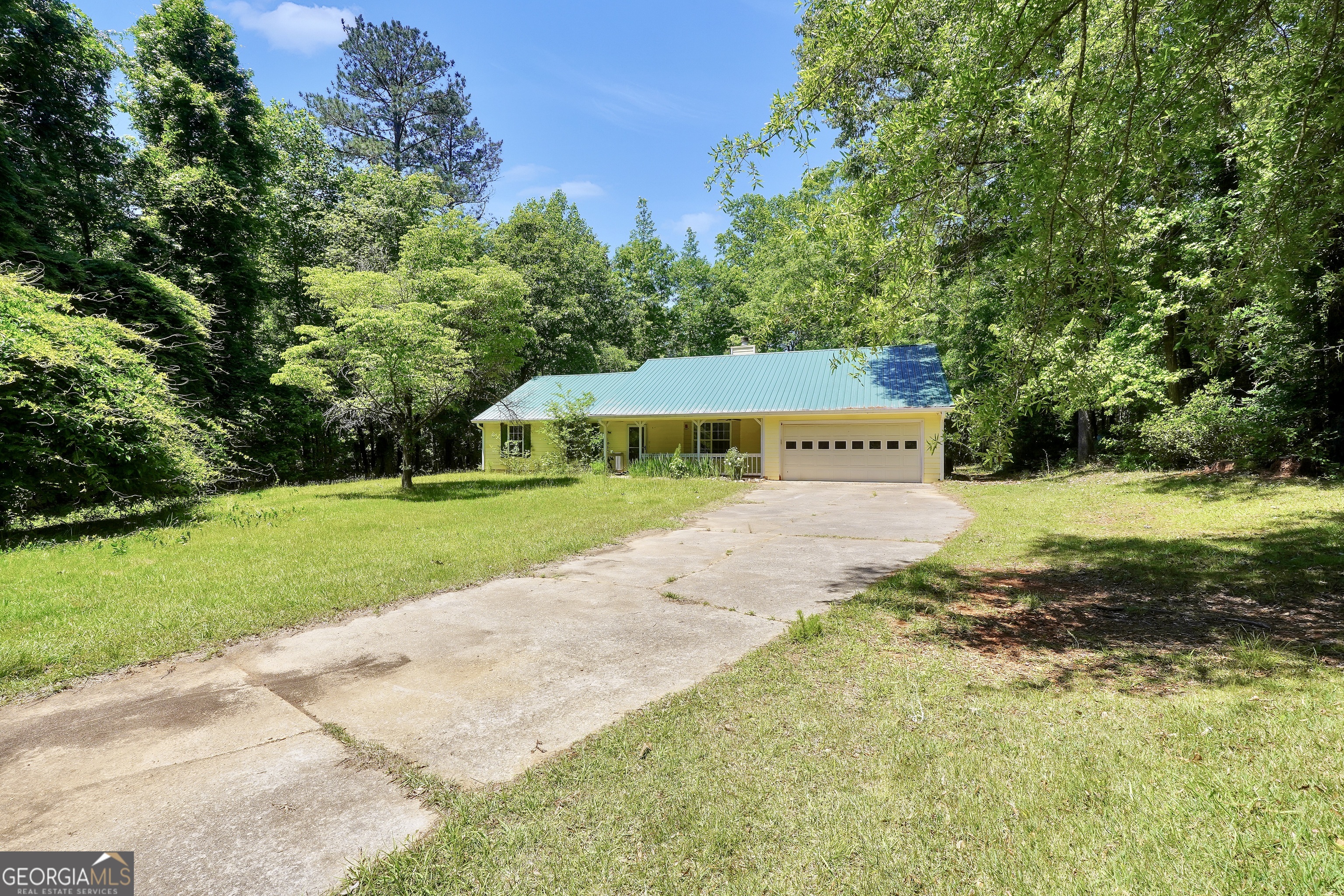 715 Concord Road Shady Dale, GA 31085 - Photo 1 of 38 a view of a house with a yard