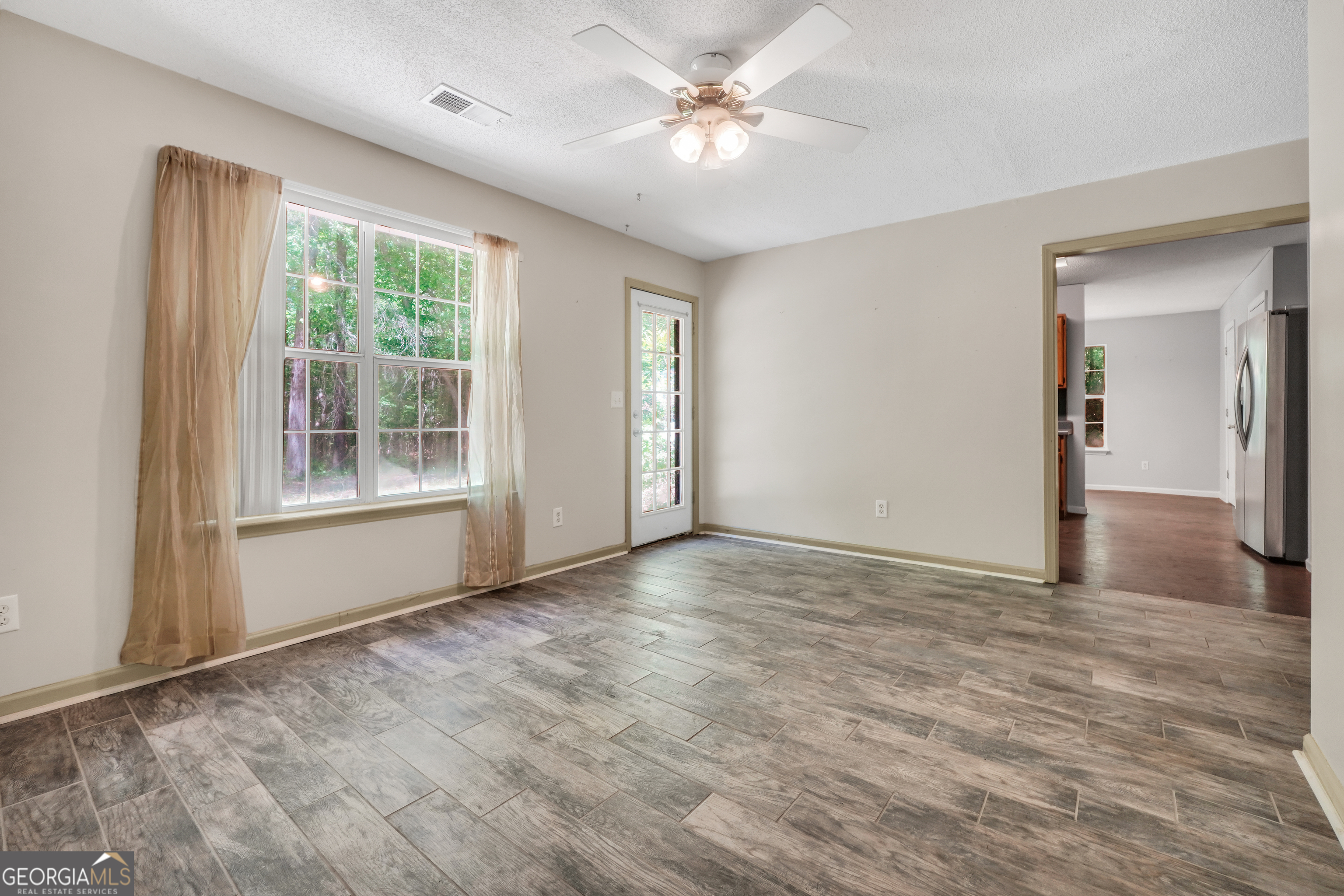 715 Concord Road Shady Dale, GA 31085 - Photo 14 of 38 a view of an empty room with a window