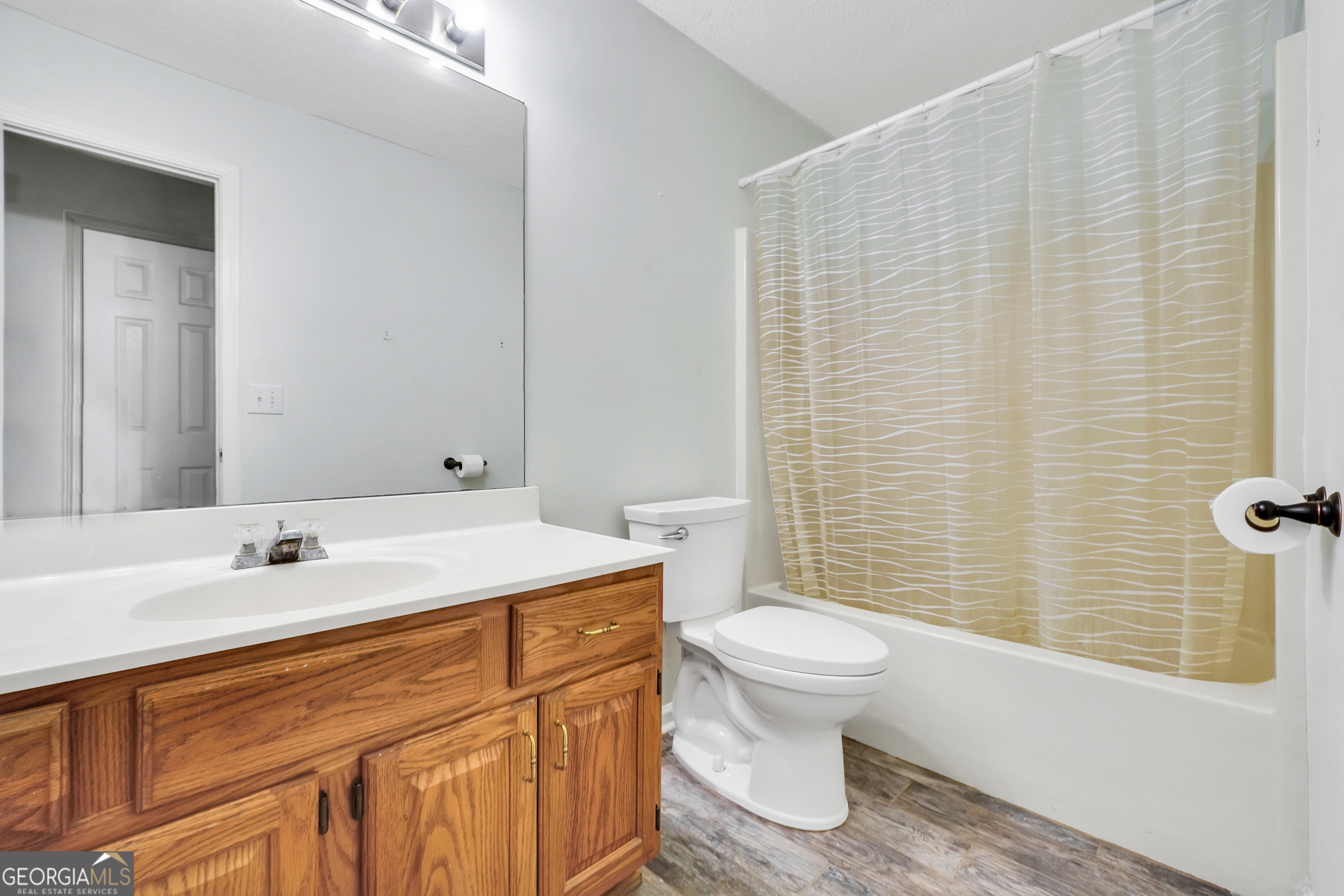 715 Concord Road Shady Dale, GA 31085 - Photo 16 of 38 a bathroom with a sink toilet and shower
