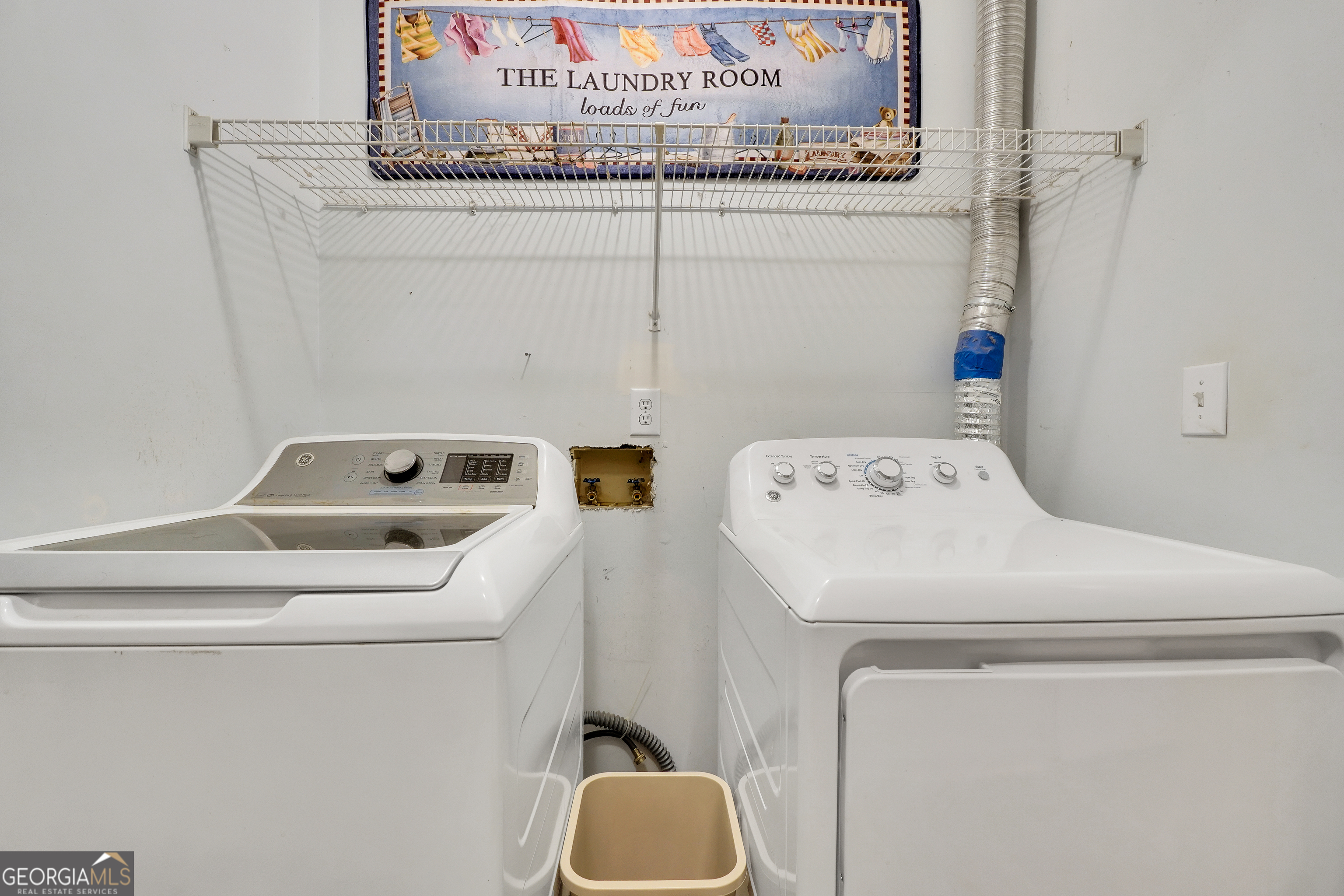 715 Concord Road Shady Dale, GA 31085 - Photo 18 of 38 a utility room with dryer and washer