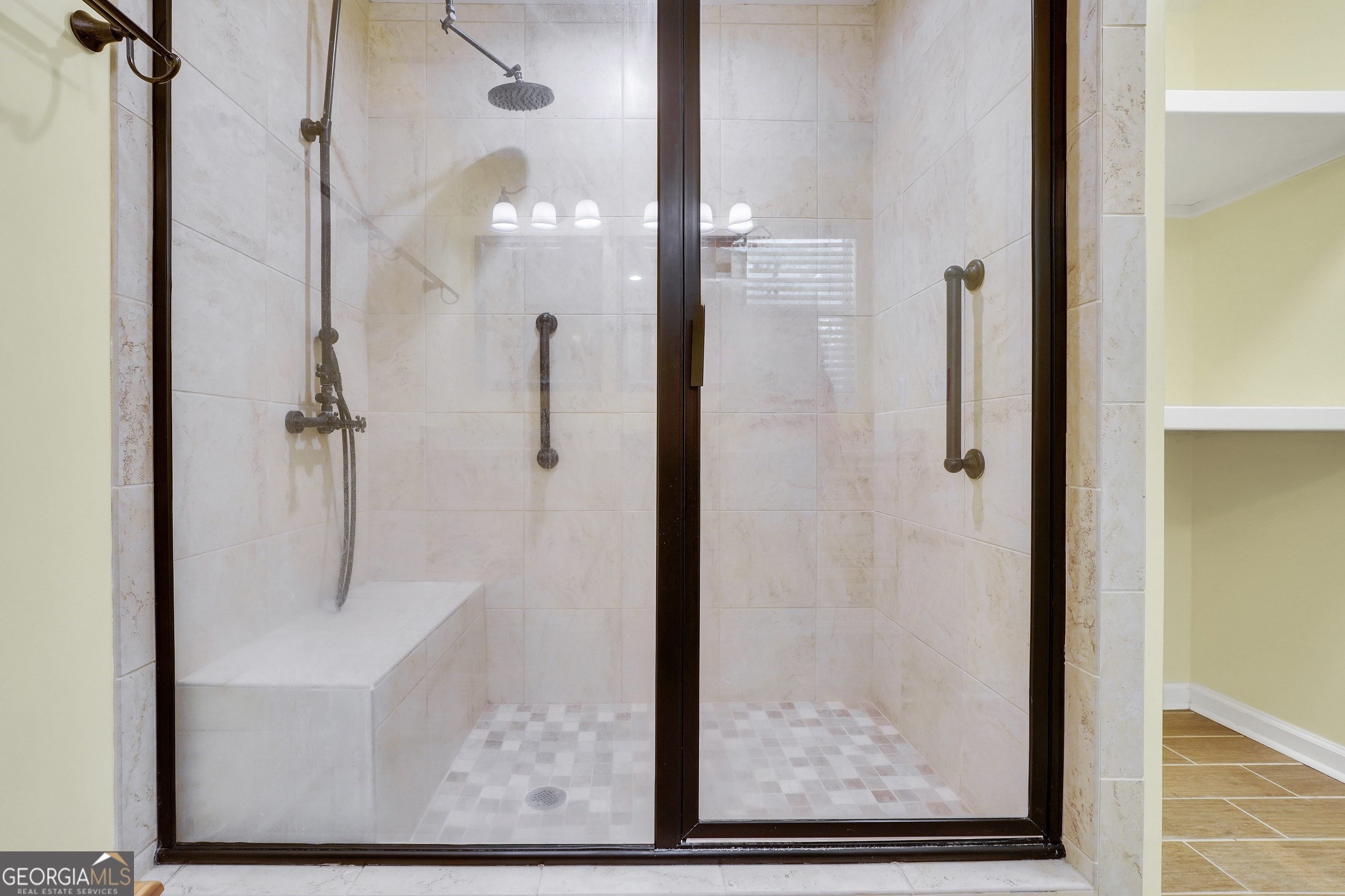 715 Concord Road Shady Dale, GA 31085 - Photo 26 of 38 a bathroom with a glass shower door