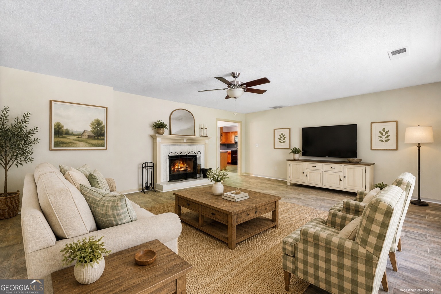 715 Concord Road Shady Dale, GA 31085 - Photo 29 of 38 a living room with furniture and a flat screen tv