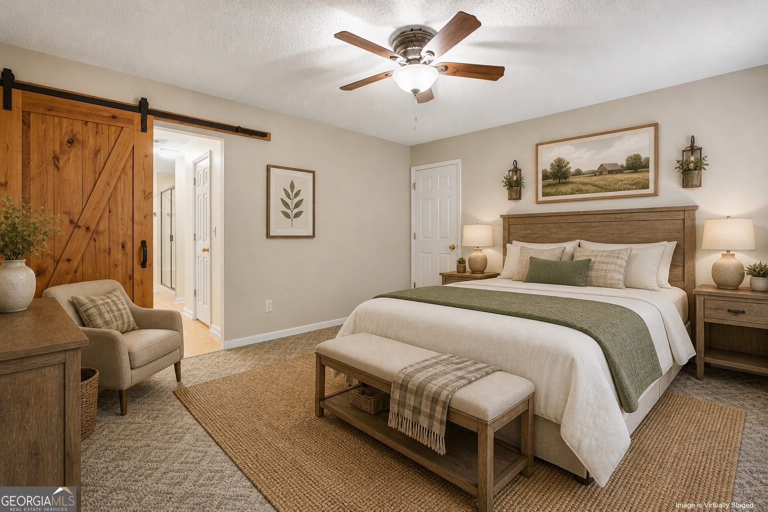 715 Concord Road Shady Dale, GA 31085 - Photo 30 of 38 a spacious bedroom with a bed and a chandelier