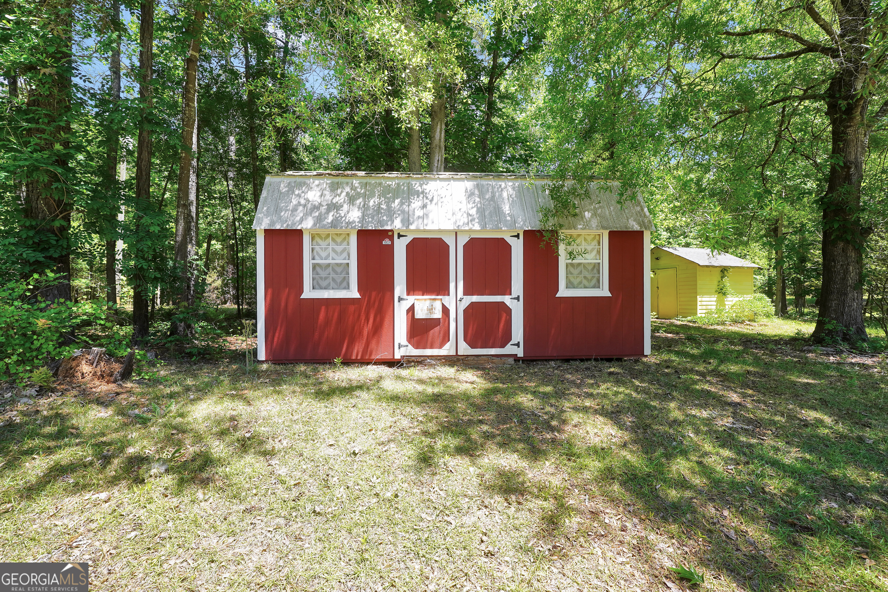 715 Concord Road Shady Dale, GA 31085 - Photo 31 of 38 a view of a house with a yard and tree
