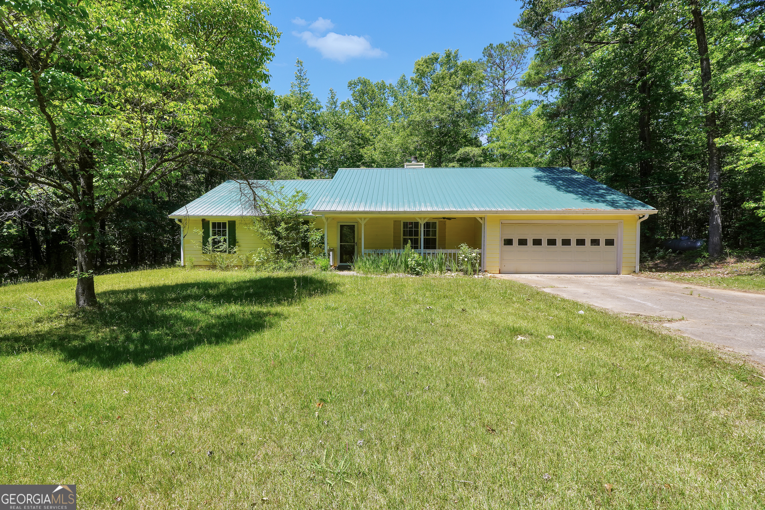 715 Concord Road Shady Dale, GA 31085 - Photo 37 of 38 a view of a house with a big yard