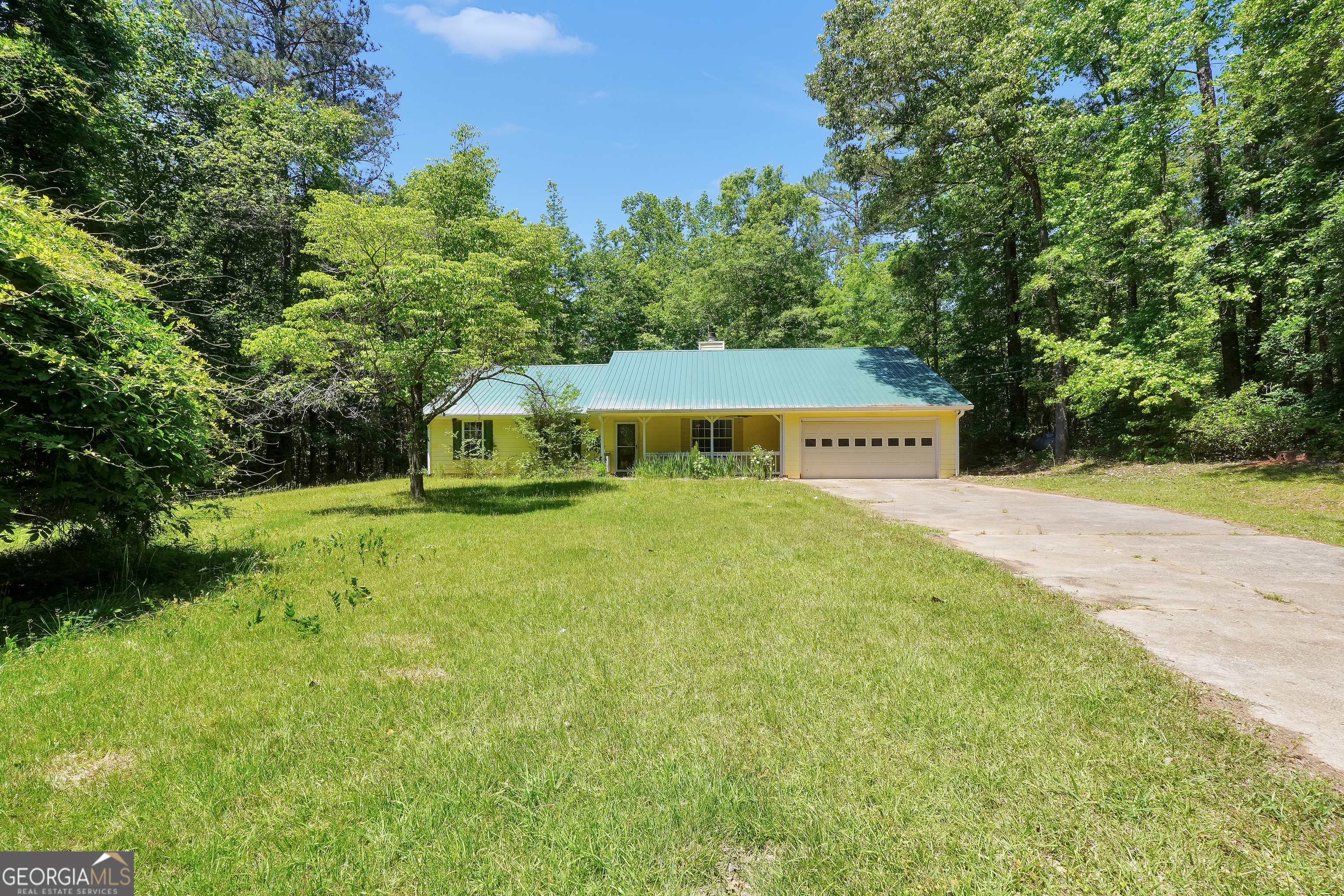 715 Concord Road Shady Dale, GA 31085 - Photo 38 of 38 a view of a house with a yard