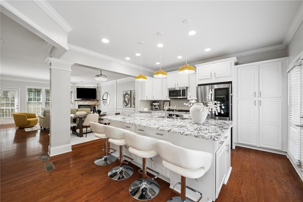 2872 Overlook Way Northeast Atlanta, GA 30324 - Photo 1 of 47 a living room with stainless steel appliances furniture and a wooden floor