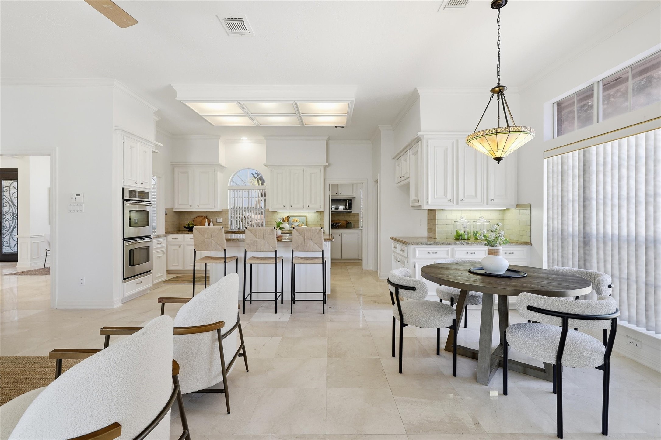 1918 Winter Knoll Way Houston, TX 77062 - Photo 17 of 46 Bright breakfast area adjacent to the kitchen, offering a cozy space for casual meals with views to the backyard