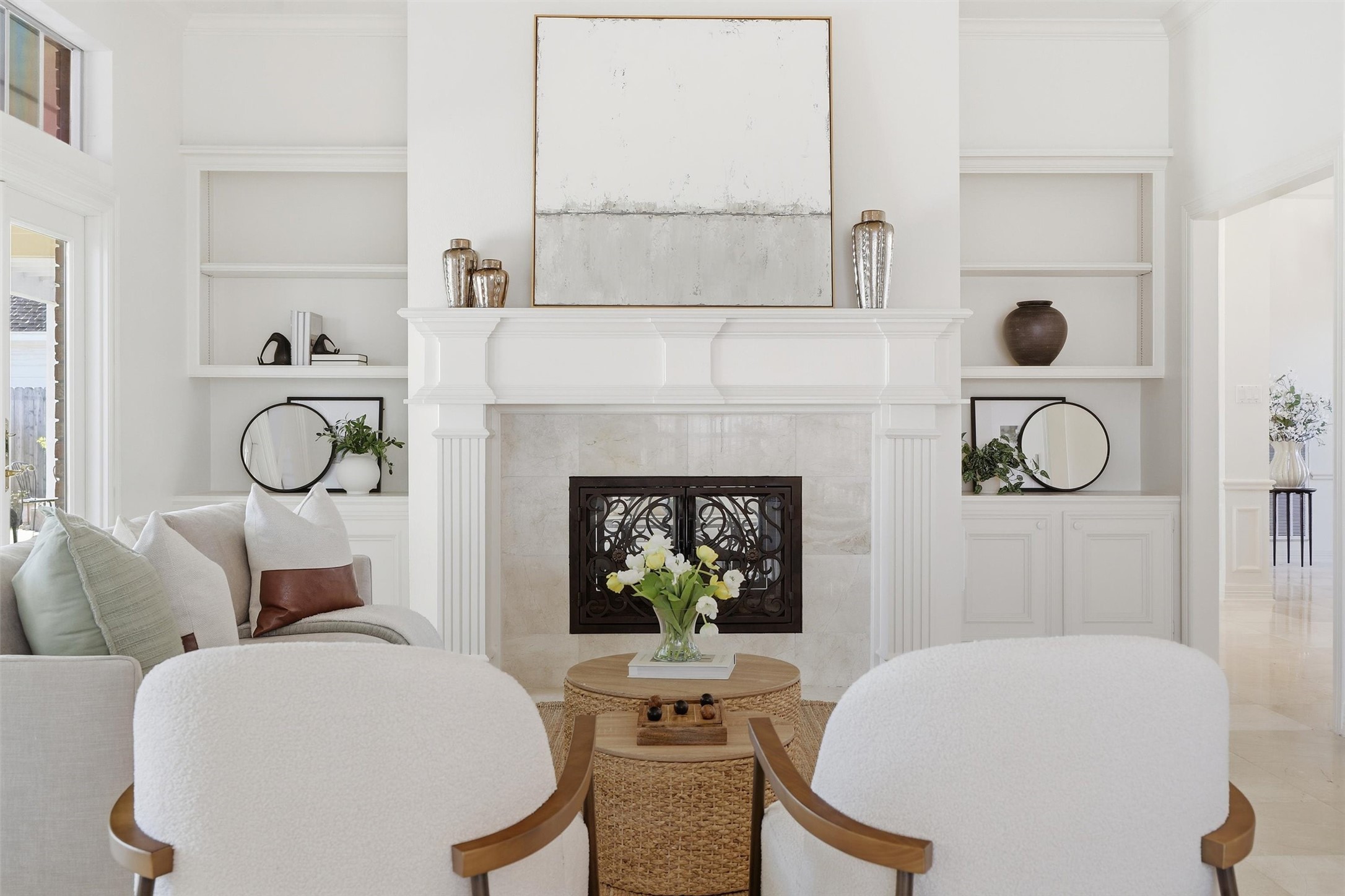 1918 Winter Knoll Way Houston, TX 77062 - Photo 19 of 46 Two-way fireplace with decorative iron doors serves as a stunning focal point connecting the living and family rooms.