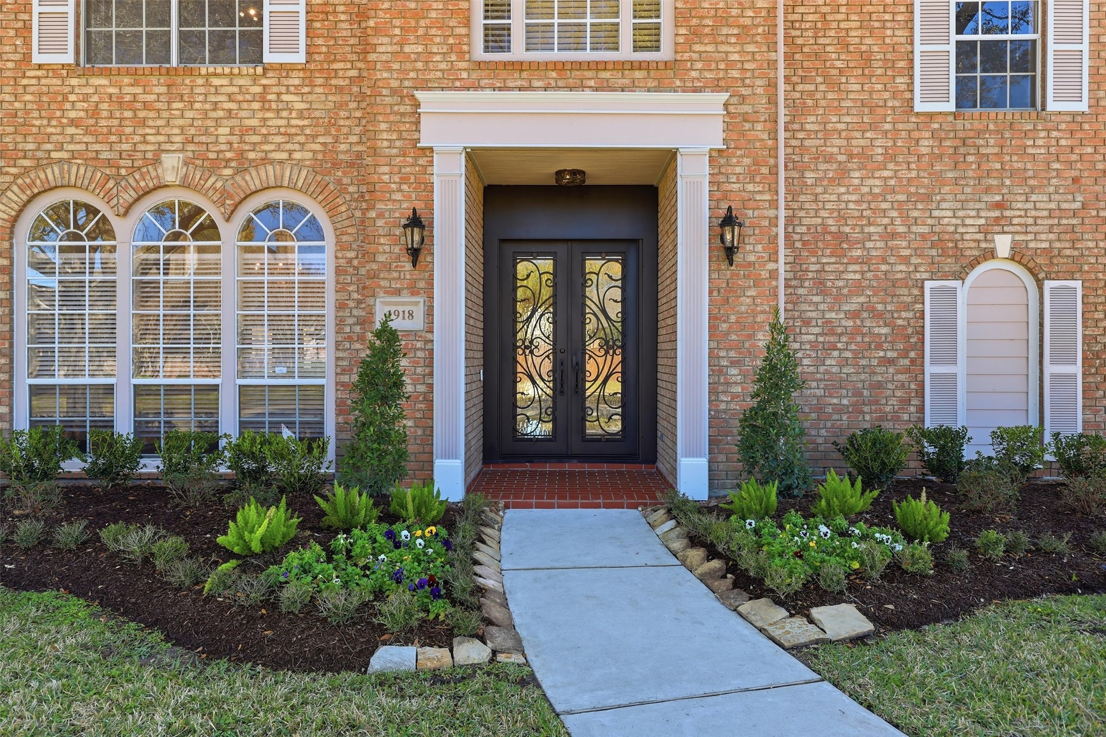 1918 Winter Knoll Way Houston, TX 77062 - Photo 2 of 46 Striking iron doors and a grand double-door entry welcome you to this beautifully maintained Bay Oaks home.