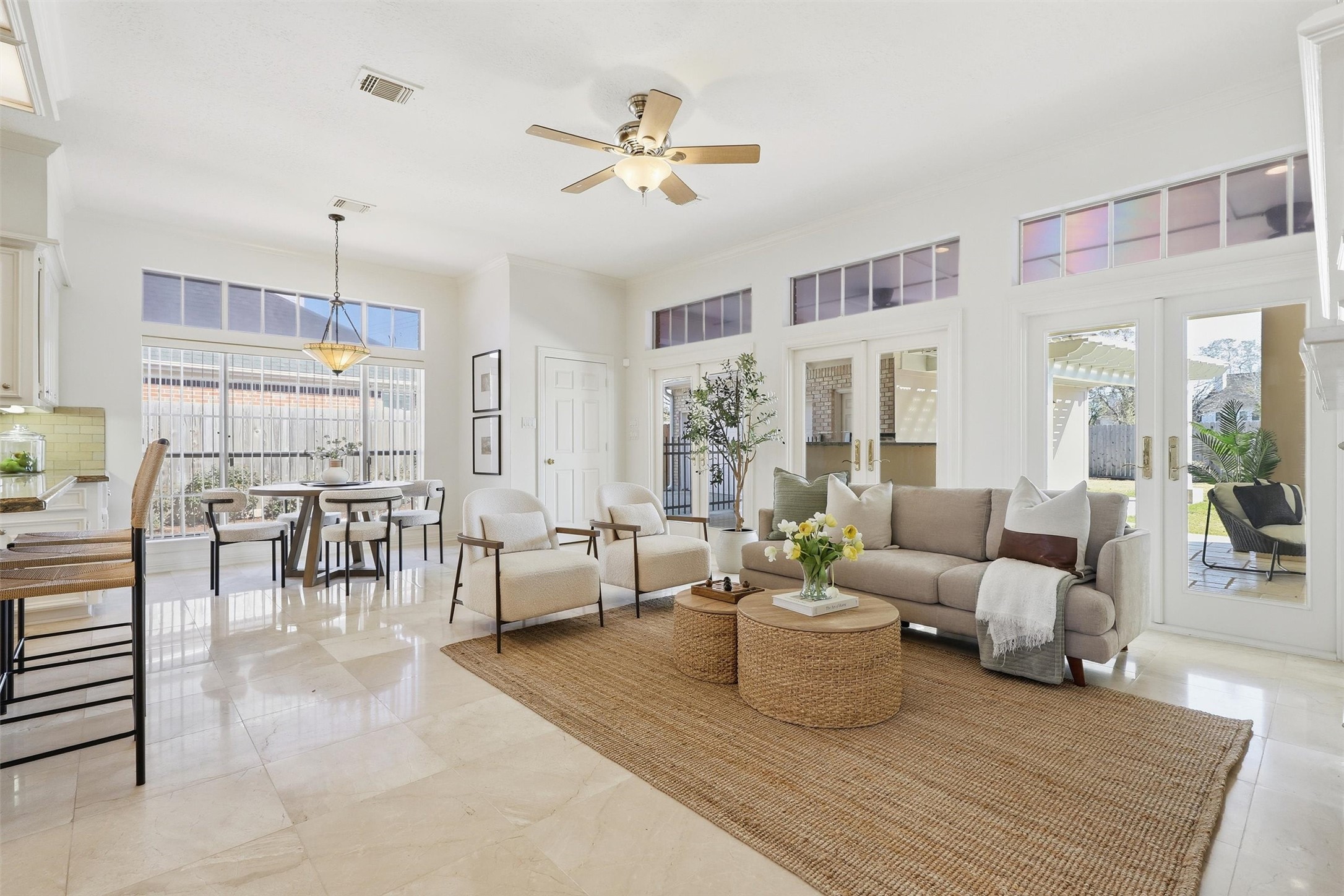 1918 Winter Knoll Way Houston, TX 77062 - Photo 20 of 46 Stunning open-concept view showcasing the family room, breakfast area, and kitchen, filled with natural light and elegant finishes.
