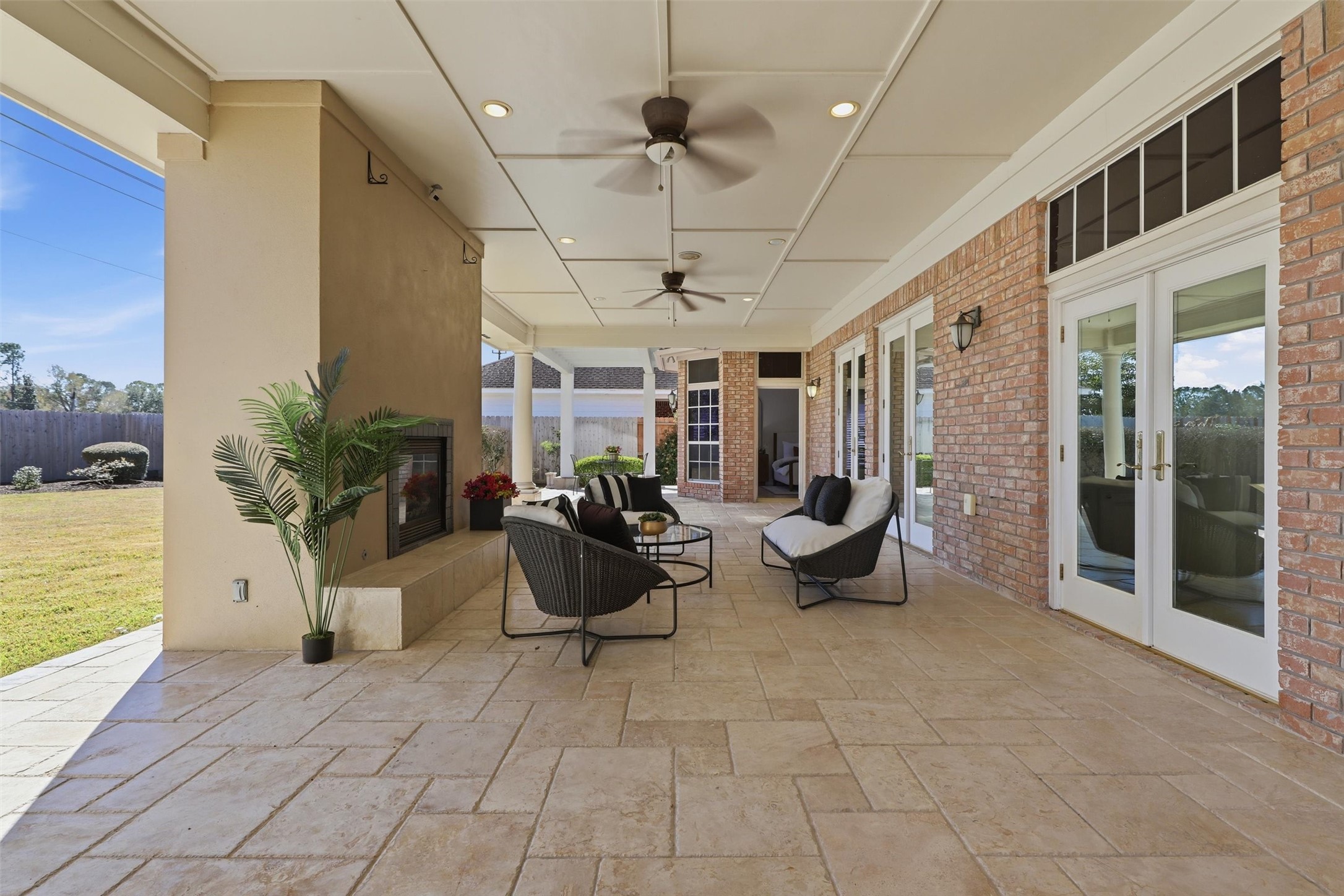1918 Winter Knoll Way Houston, TX 77062 - Photo 28 of 46 Custom-designed 61x39 covered travertine patio, ideal for outdoor entertaining.