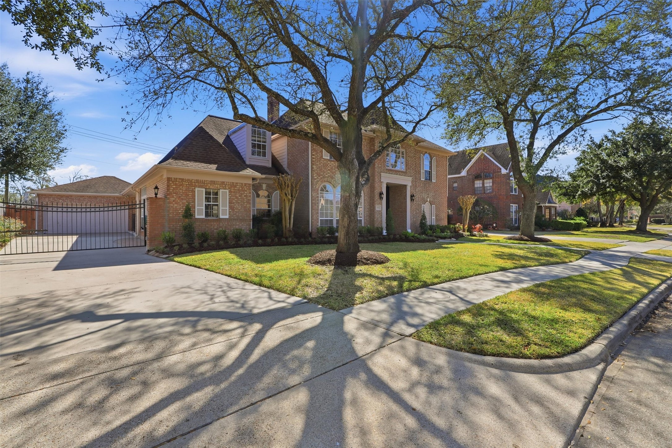 1918 Winter Knoll Way Houston, TX 77062 - Photo 41 of 46 Electric driveway gate leading to the detached garage.