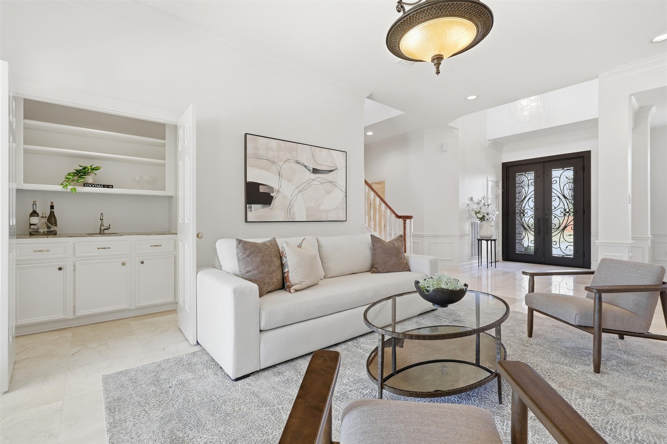 1918 Winter Knoll Way Houston, TX 77062 - Photo 6 of 46 Light-filled living space featuring a wet bar, ideal for entertaining.