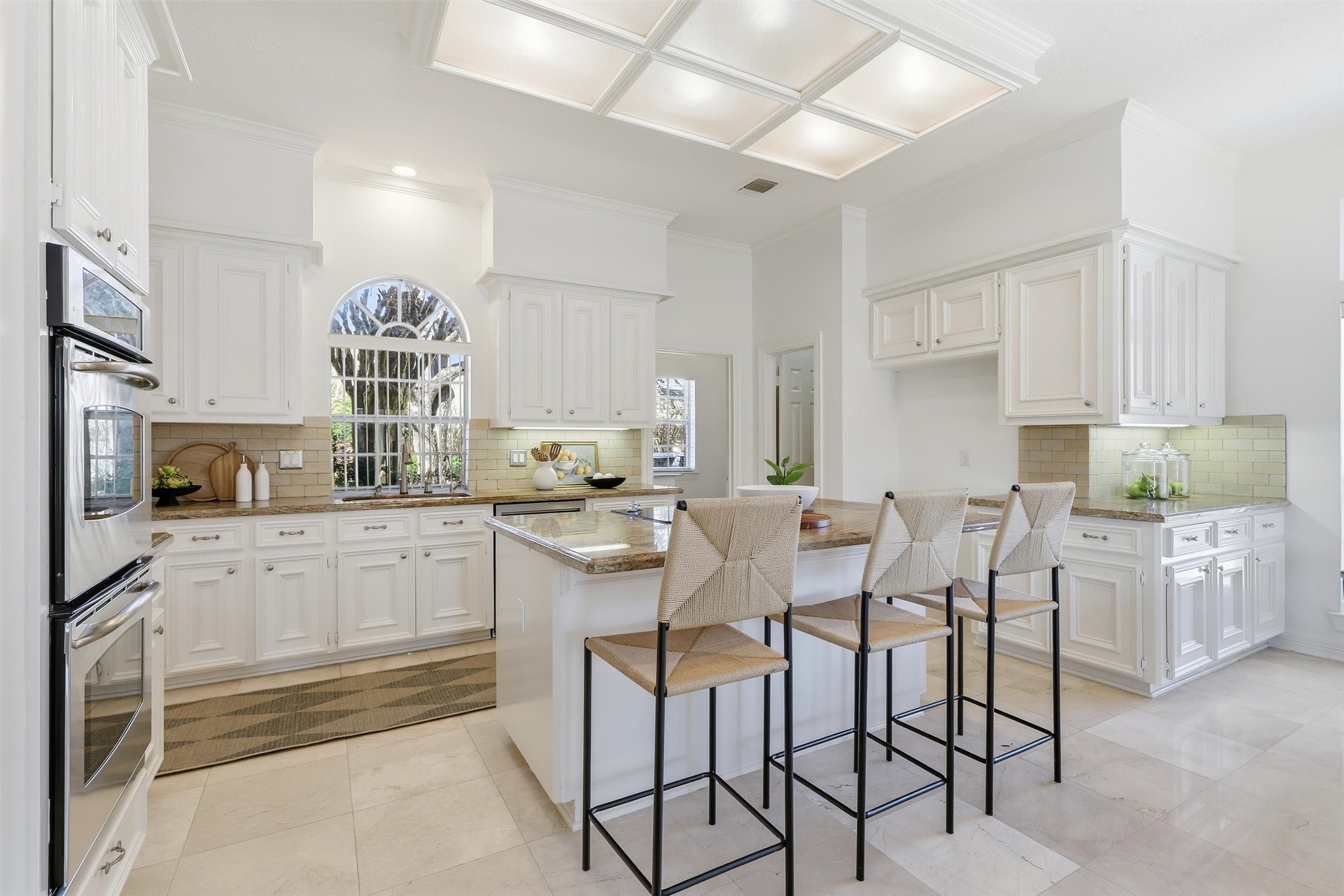 1918 Winter Knoll Way Houston, TX 77062 - Photo 8 of 46 Bright kitchen featuring white cabinetry, granite countertops, and a functional, open layout.