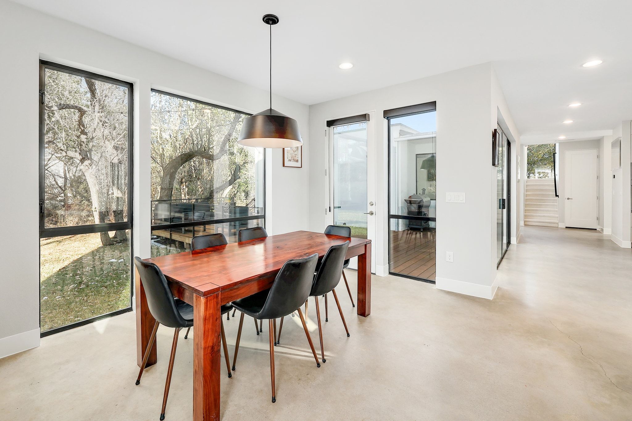 5710 Longhorn Landing Austin, TX 78734 - Photo 12 of 37 a view of a dining room with furniture window and wooden floor