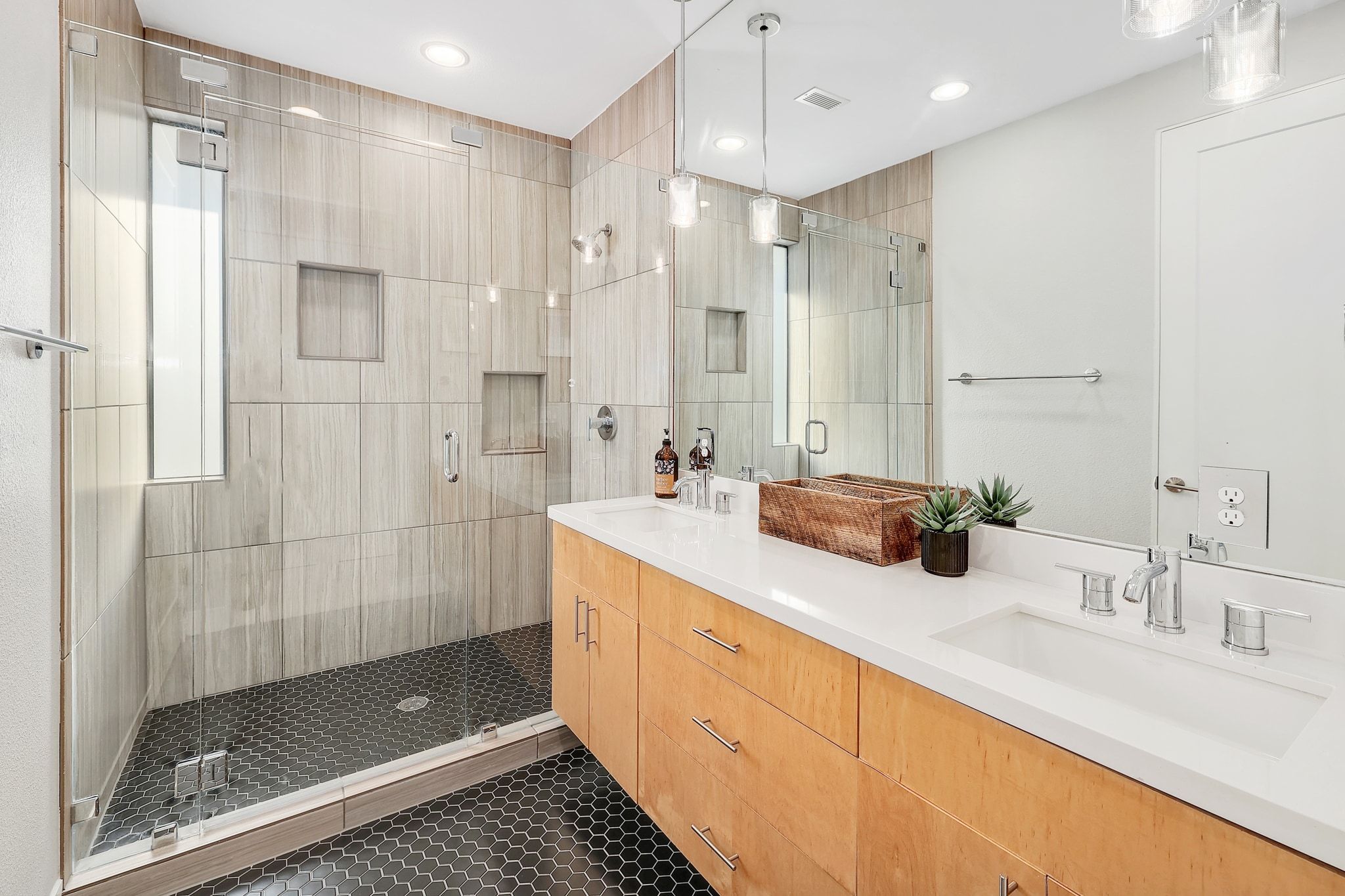 5710 Longhorn Landing Austin, TX 78734 - Photo 14 of 37 a bathroom with a shower sink and mirror