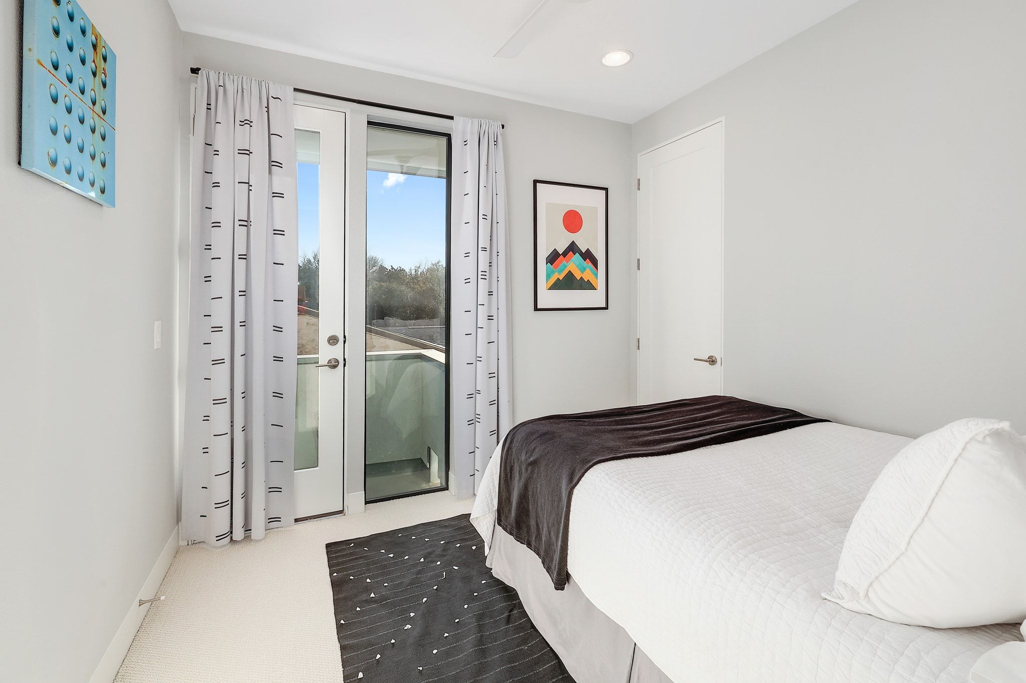 5710 Longhorn Landing Austin, TX 78734 - Photo 17 of 37 a bedroom with a bed and a painting on the wall