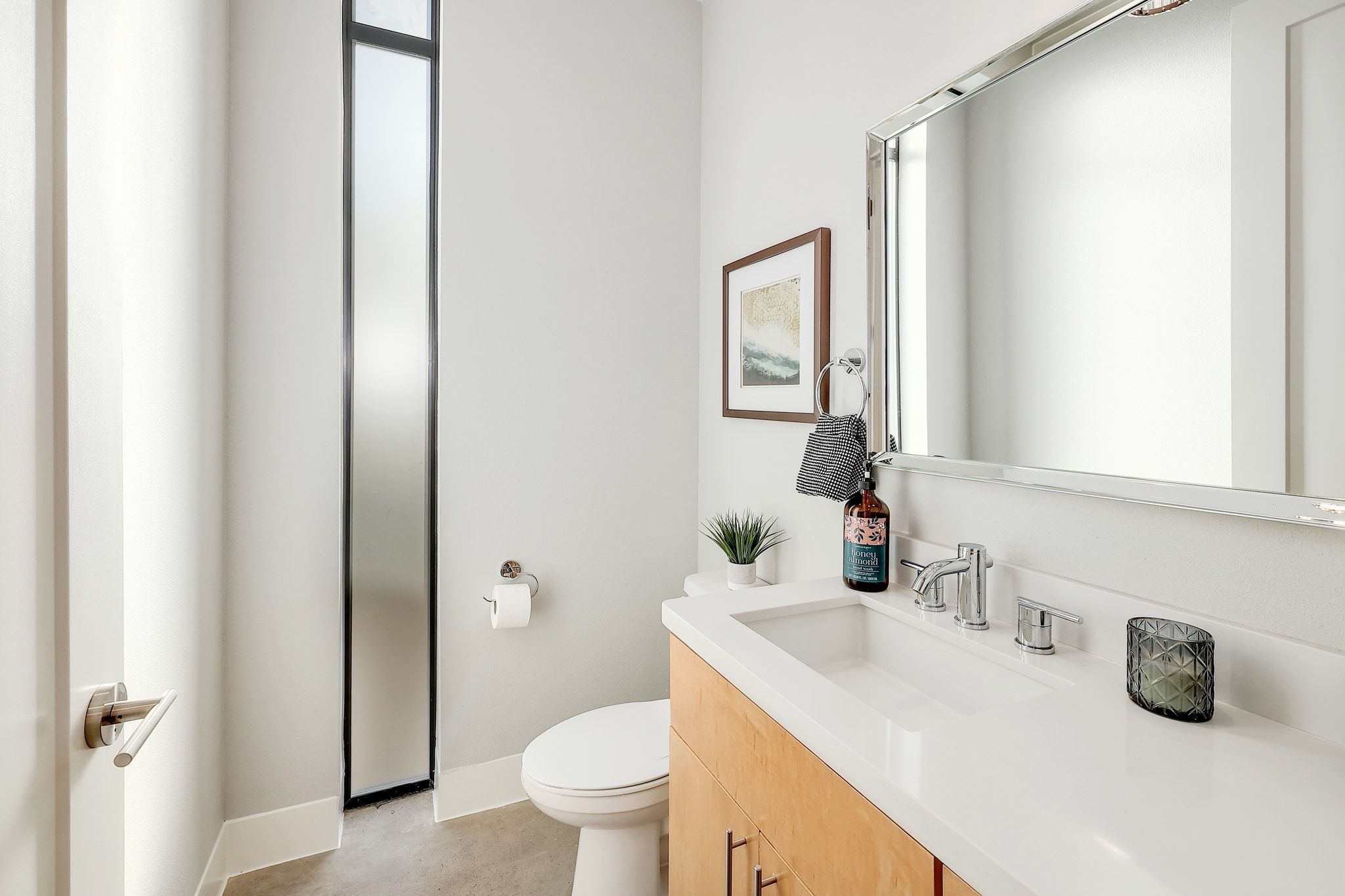 5710 Longhorn Landing Austin, TX 78734 - Photo 21 of 37 a bathroom with a sink a toilet and a mirror