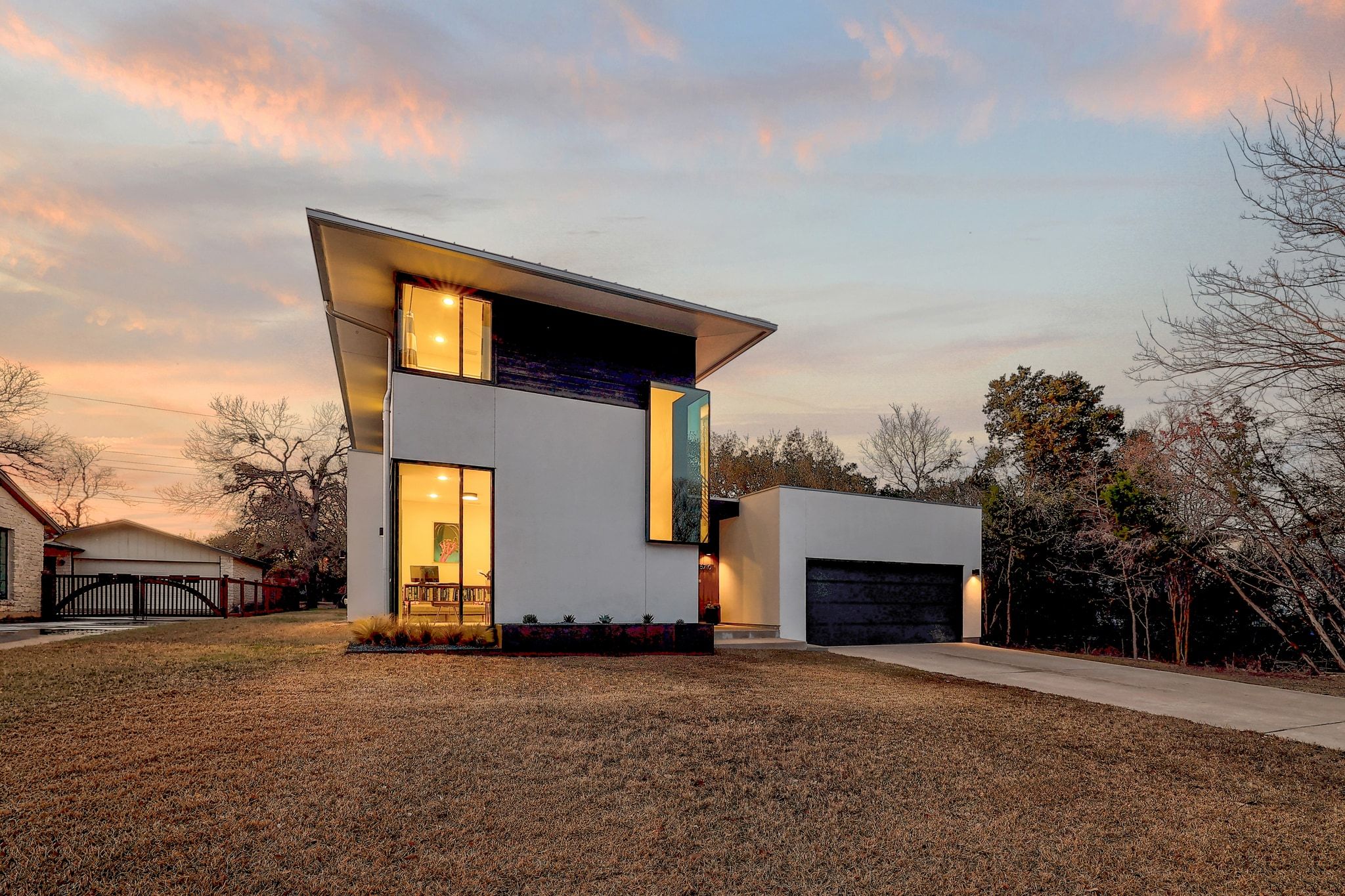5710 Longhorn Landing Austin, TX 78734 - Photo 25 of 37 a front view of a house with a yard and garage