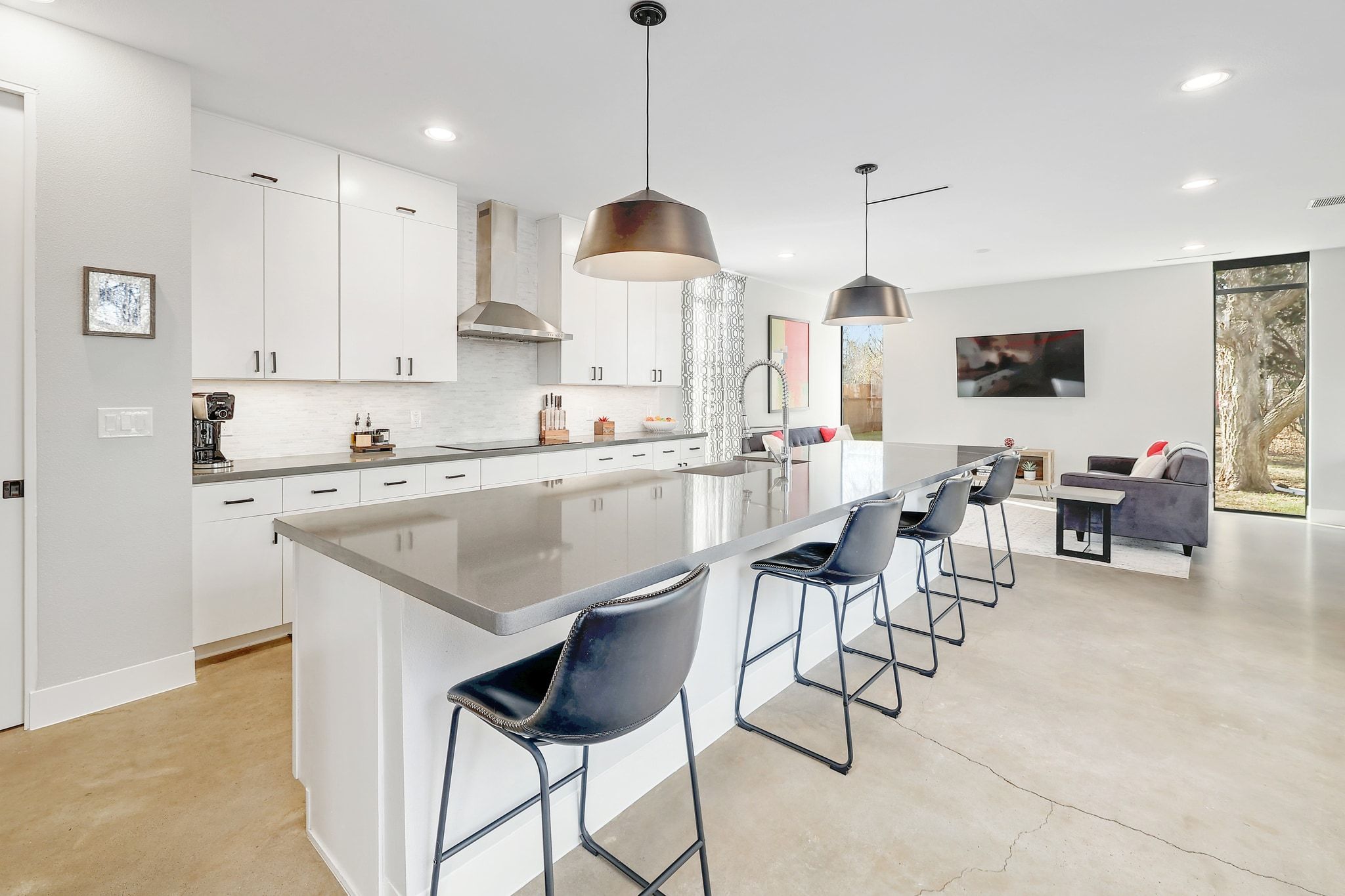5710 Longhorn Landing Austin, TX 78734 - Photo 5 of 37 a kitchen with stainless steel appliances granite countertop a sink a stove a dining table and chairs