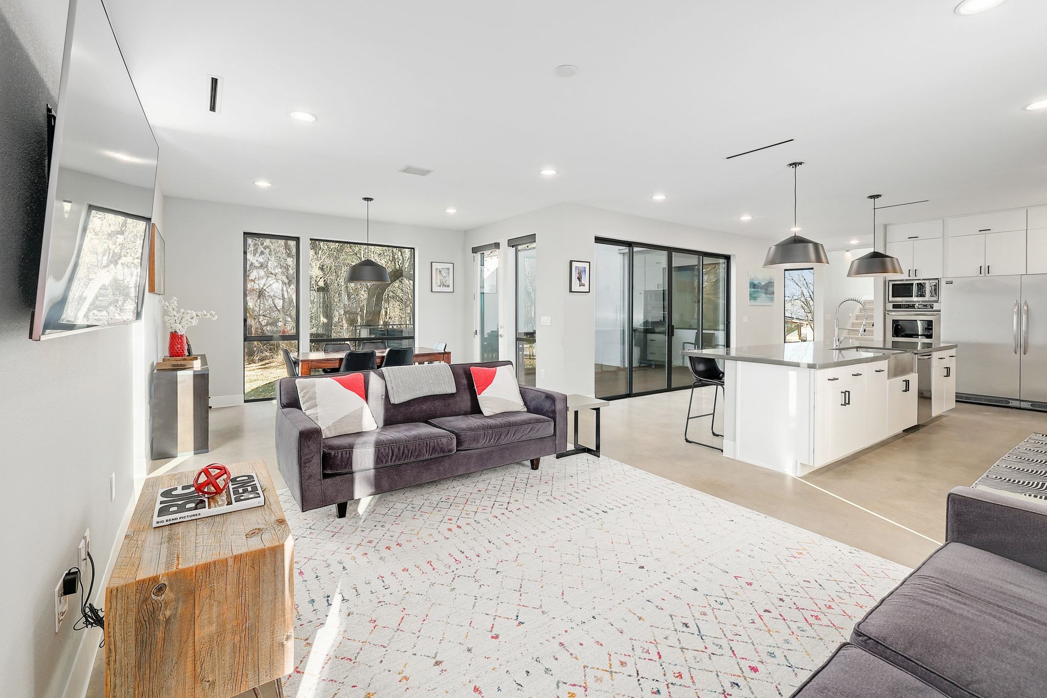 5710 Longhorn Landing Austin, TX 78734 - Photo 9 of 37 a living room with furniture and kitchen view