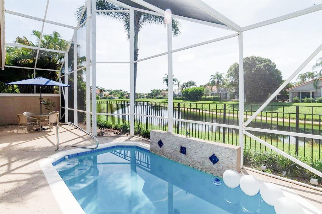 6192 Northwest 24th Street Boca Raton, FL 33434 - Photo 1 of 57 a house view with a seating space and garden view