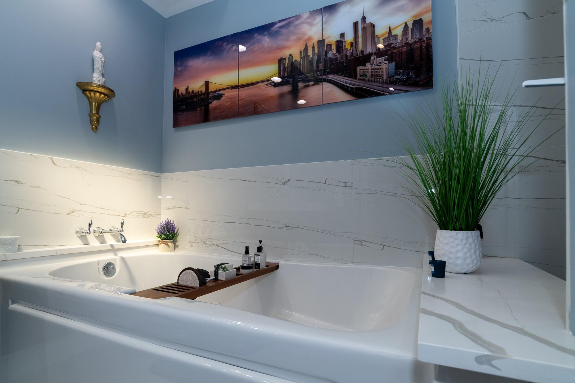 6192 Northwest 24th Street Boca Raton, FL 33434 - Photo 17 of 57 a bathroom with a sink a mirror and vanity